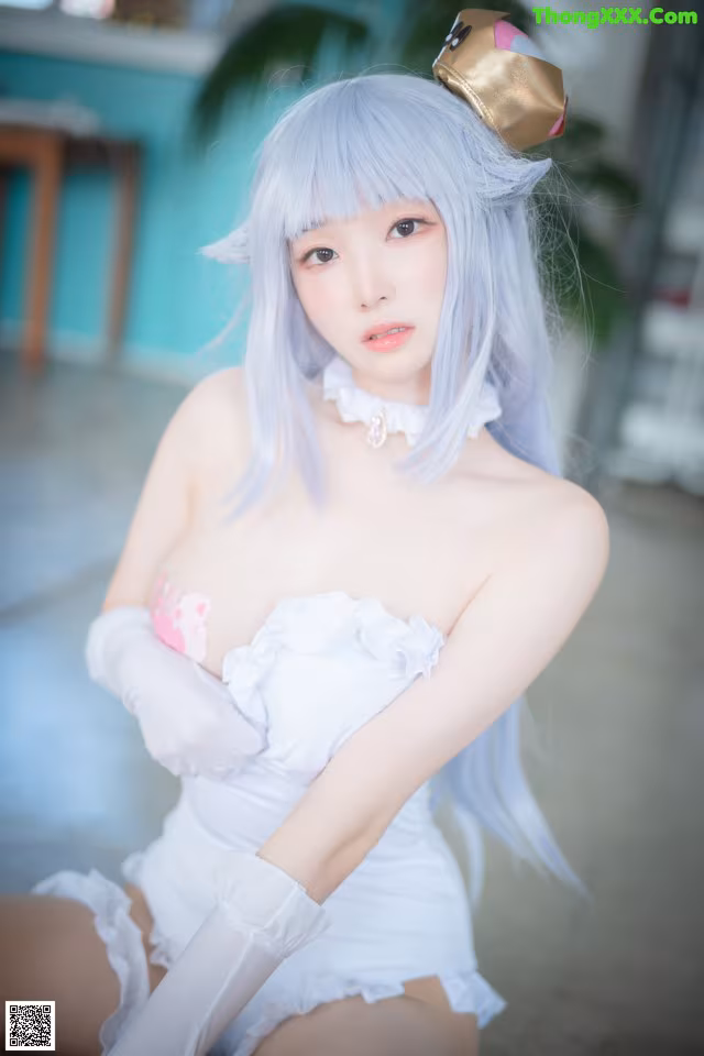 A woman with long blue hair wearing a white dress and gloves.